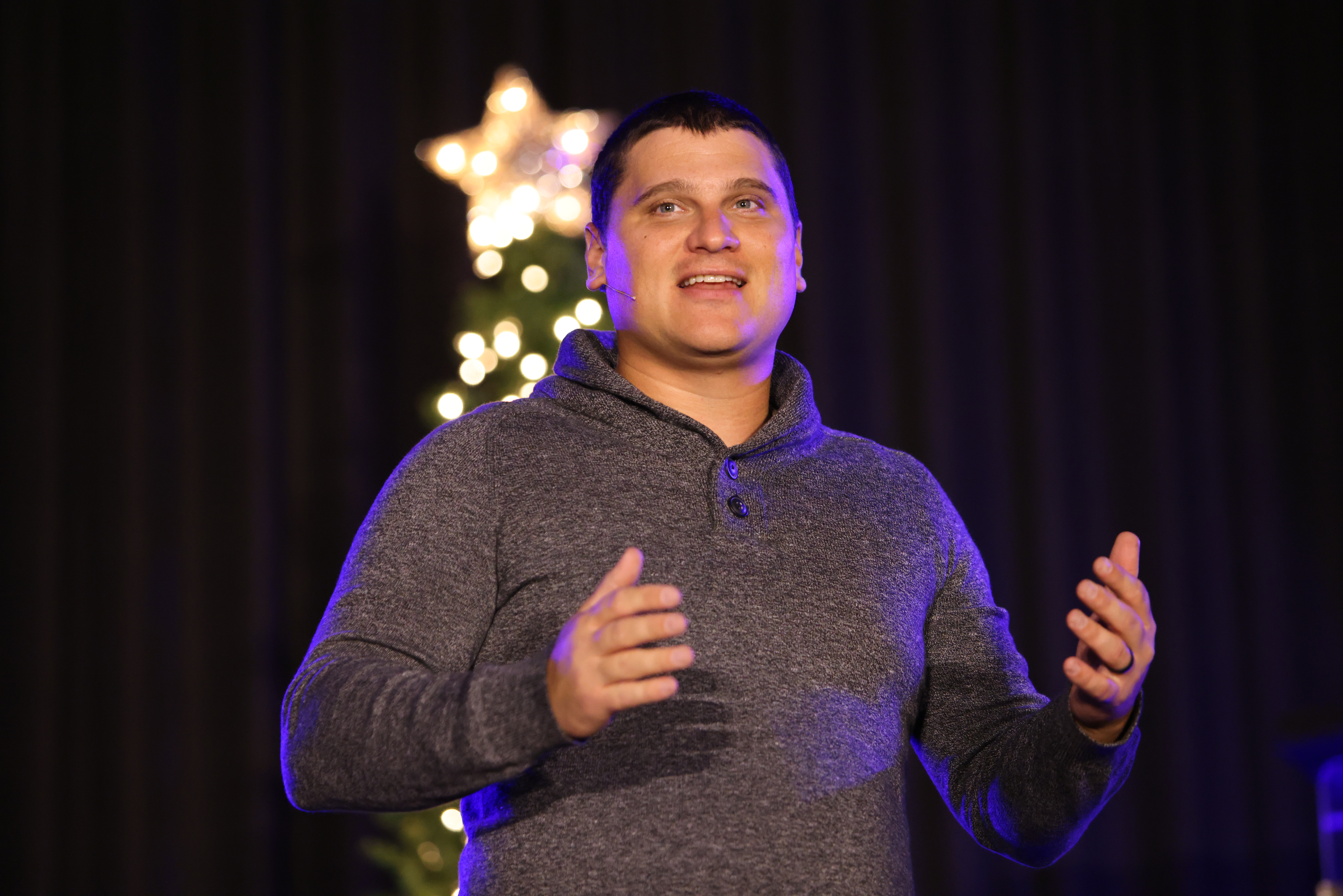 Pastor speaking at Tekoa Church's Christmas service